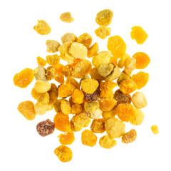 top view of handful of natural bee pollen isolated on white background