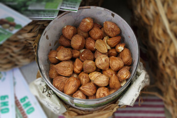 Bowl of raw peeled hazelnuts. Vegan food