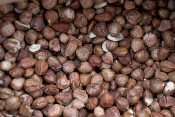 Background and pattern of raw peeled hazelnuts.