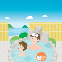 海の見える露天風呂に入る親子