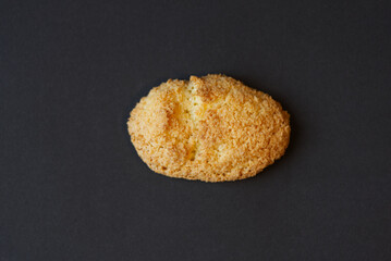 Coconut cookie against black background. Photo taken December 29th, 2021, Zurich, Switzerland.