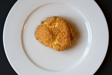 Coconut cookie on white plate. Photo taken December 29th, 2021, Zurich, Switzerland.