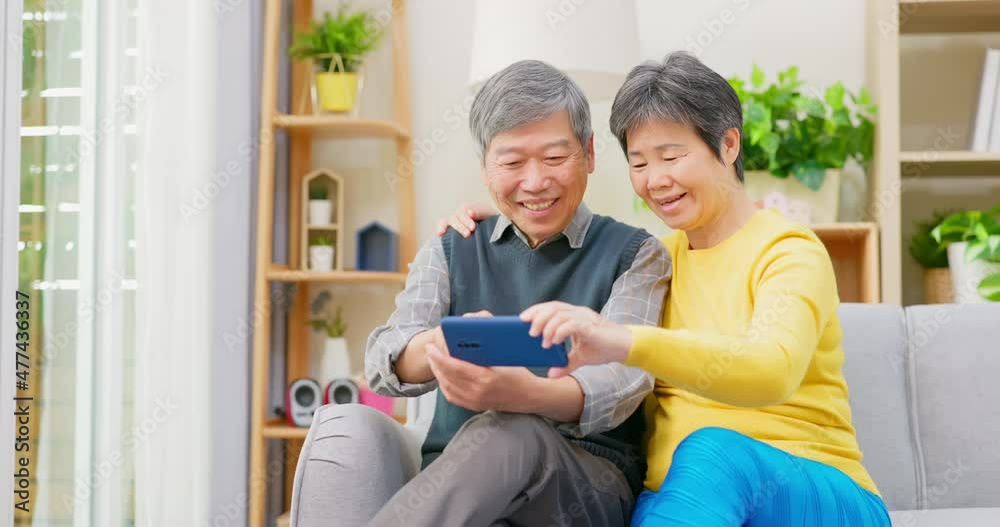 Wall mural elderly couple use phone