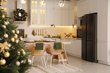 Cozy open plan kitchen decorated for Christmas. Interior design