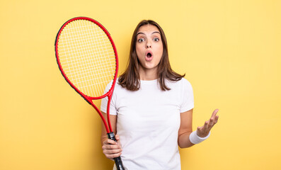 pretty woman amazed, shocked and astonished with an unbelievable surprise. tennis player concept