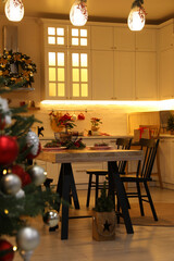 Cozy dining room decorated for Christmas. Interior design