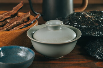 Bowl with brewed Chinese Lingzhi or Reishi mushroom on wooden table. Asian herbs for health. Herbal medicine.
