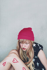 Moody portrait of a young and sad woman