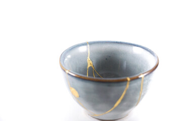 kintsugi gold cracks restoration, Japanese bowl fixed with the antique kintsukuroi restoration...