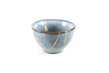 kintsugi gold cracks restoration, Japanese bowl fixed with the antique kintsukuroi restoration...