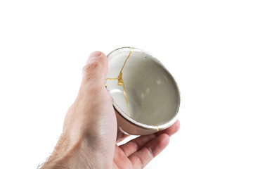 kintsugi gold cracks restoration, Japanese bowl fixed with the antique kintsukuroi restoration...