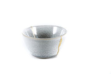 kintsugi gold cracks restoration, Japanese bowl fixed with the antique kintsukuroi restoration...