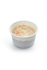 Coleslaw in plastic cup isolated on white background. Clipping path