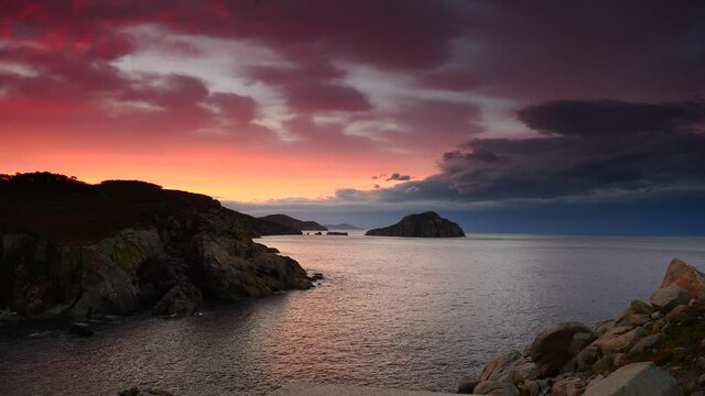 Seascape at sunset. Mediterranean sea and rocky coast in the evening. Cabo de Moras landscape in Galicia Spain.