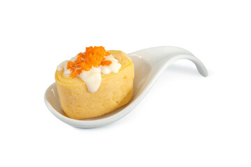 Japanese sweet egg roll topped with salad dressing and Shrimp eggs served on spoon, sweet egg sushi isolated on white background. 