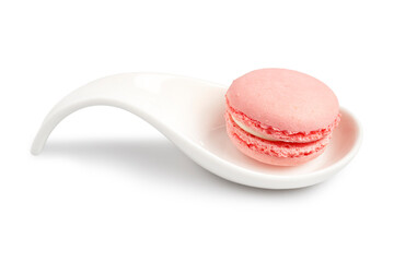 Fresh Homemade Pink Strawberry Macaron, French delicate dessert suitable for teatime, serving on white spoon isolated on white background. Clipping path