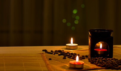 Scented lamp, candles and coffee beans
