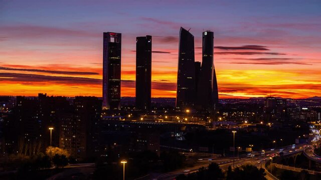 Madrid Skyline and motorway traffic Timelapse day to night sunset