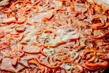 Obraz na płótnie Canvas Hot Homemade Pepperoni Pizza with melting cheese bacon tomatoes ham paprika