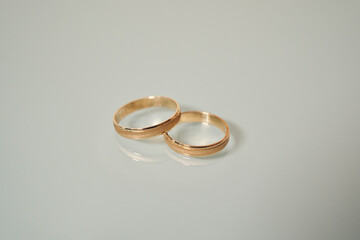 Two matching traditional gold wedding or engagement rings