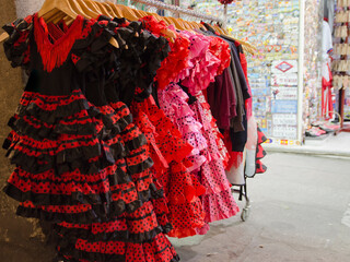 Fototapeta na wymiar A view of some sevillana dresses in some colours, typical spanish dance