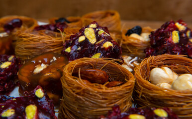 Traditional multi-colored arabic sweets baklava, lokum, muska pestili and nuts assortment. Top view.