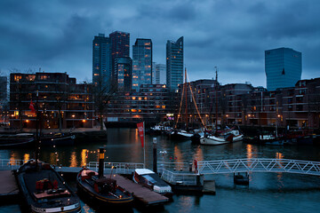 photo of the evening city with a large number of lights of the river buildings