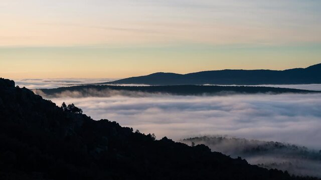 Pedriza Park timelapse of rolling fog  at sunrise