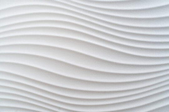 White tole decorated with geometric texture in the shape of curves. Decorative element. Design