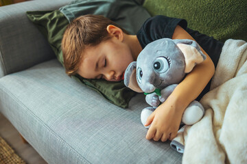Little child sleaping. High angle shot of an adorable little boy sleeping in bed at home. Four...