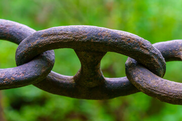 Close up of an old heavy iron chain link