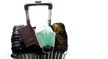 Fototapeta premium Luggage and travel,Suitcase, passport and medical mask,Flights canceled or delayed transportation business passenger COVID-19 crisis flight cancelled and coronavirus suffer from financial