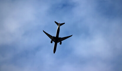 Plane in the sky with clouds