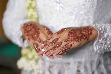 traditional wedding, bridal showing henna design and hand jewellery