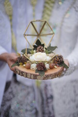 Engagement ring box in bride hands. Closeup of woman palms holding jewellery. Love, Wedding, Proposing, Marriage concept. Rustic chic style