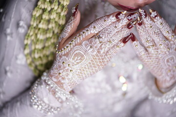 traditional wedding, bridal showing henna design and hand jewellery