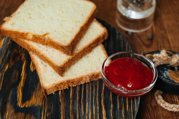 Toast bread on a wooden background. Meat sauce. Tomatoes. - obrazy, fototapety, plakaty