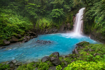 Fototapeta na wymiar Waterfall and turquoise water of Rio Celeste, Costa Rica. Paradise.
