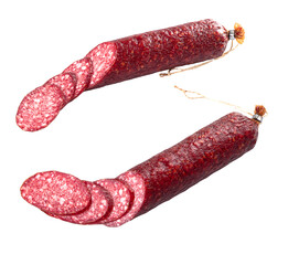Slices of smoked sausage and a sausage stick isolated on a white background