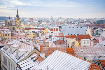 Panorama of Prague roofs covered with snow in winter, Czech Republic