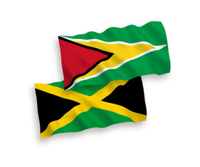 National vector fabric wave flags of Co-operative Republic of Guyana and Jamaica isolated on white background. 1 to 2 proportion.