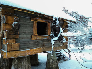 A hut in the snow. Fairy-tale characters. The first snow.