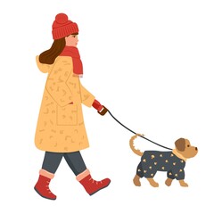 Girl in a warm coat, gloves, a hat and a scarf around her neck is walking with a dog. A small dog in a grey jumpsuit walks next to her on a leash. Illustration in flat style on white background