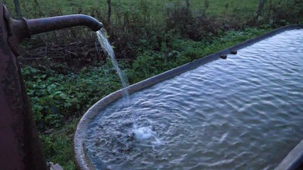 An old fountain at the end of the day in the east of France.  Jura, autumn, the 28th October 2021.