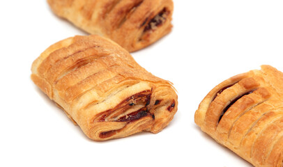 Puff pastries with jam isolated on a white background.