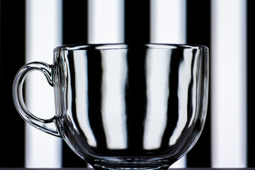 transparent glass mug on black and white background