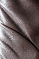 Chocolate leatherette abstract as background. Texture