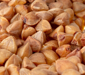 Close-up of buckwheat groats as background.