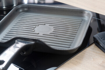 Kitchen utensils-wooden spoons and cutting boards on table close up. kitchen utensils close-up in the interior of a home kitchen.