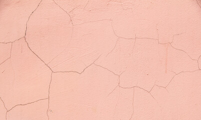 Cracked plaster on the wall as an abstract background.